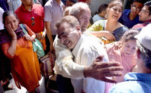 Amritsar: Indian earthquake survivors greet their relatives after being rescued by the Indian Airforce from Nepal at Amritsar airport on Monday. PTI Photo(PTI4_27_2015_000049B)